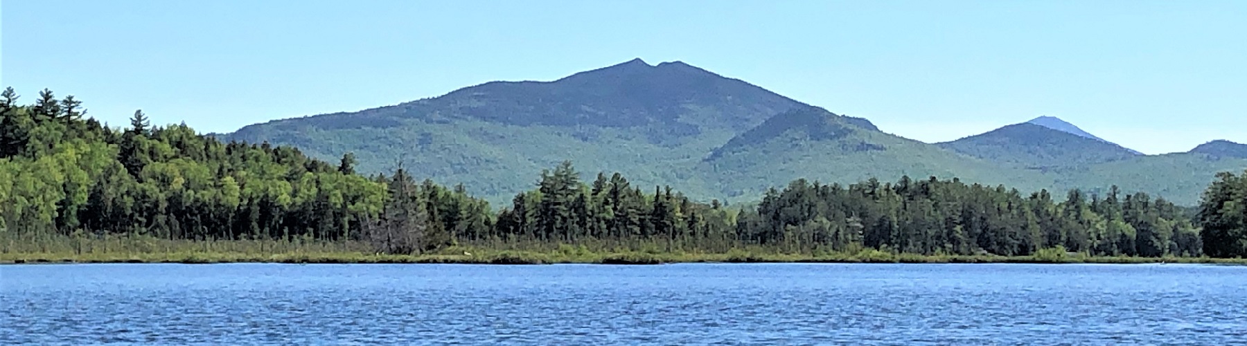 lake with mountains in the background